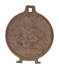 A Pair of Cast Iron Kettle Toppers and Two Trivets