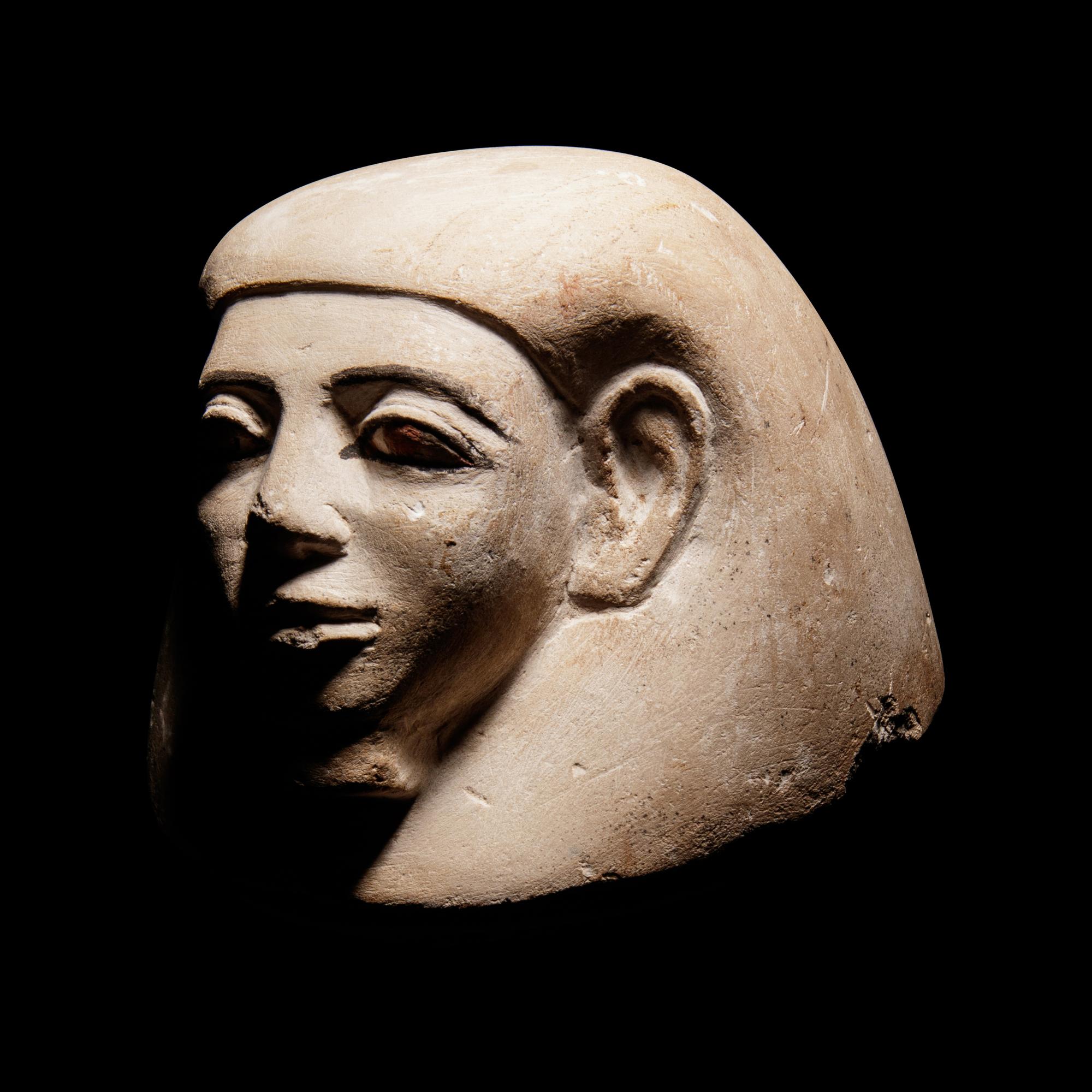 An Egyptian Stone Canopic Jar Lid