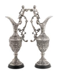 A Pair of Neoclassical Style White Metal Ewers