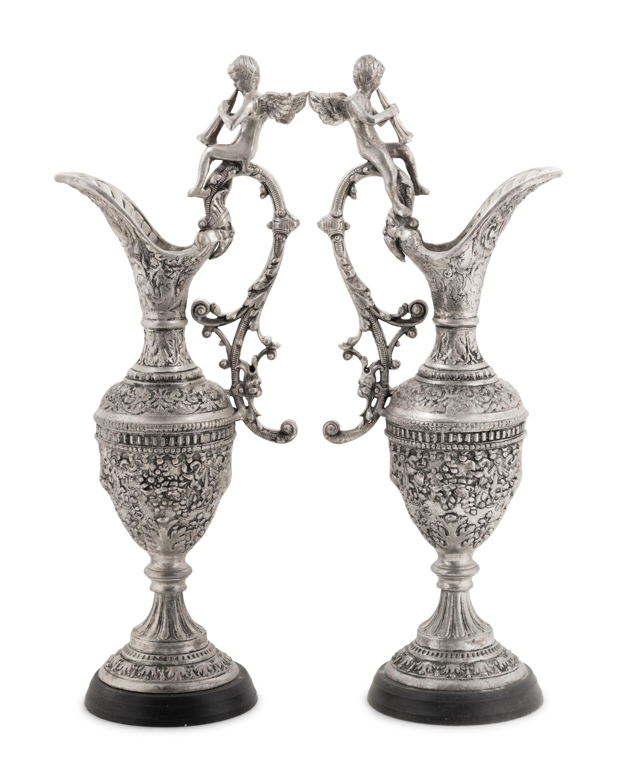 A Pair of Neoclassical Style White Metal Ewers