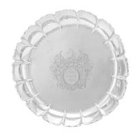 An Irish George I Silver Bowl, Anthony Stanley, Dublin, 1714, having a scalloped rim over the ribbed body centered by an engraved coat