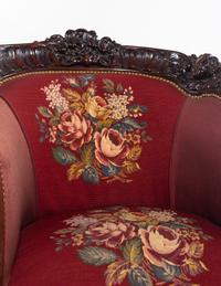 A Rococo Revival Carved Walnut Three-Piece Seating Suite in the Style of Karpen