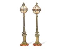 A pair of Belle Epoque gilt bronze and walnut table lamps in the form of miniature street lamps, late 19th century