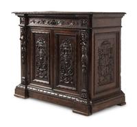 An Italian Baroque Carved Walnut Cabinet
