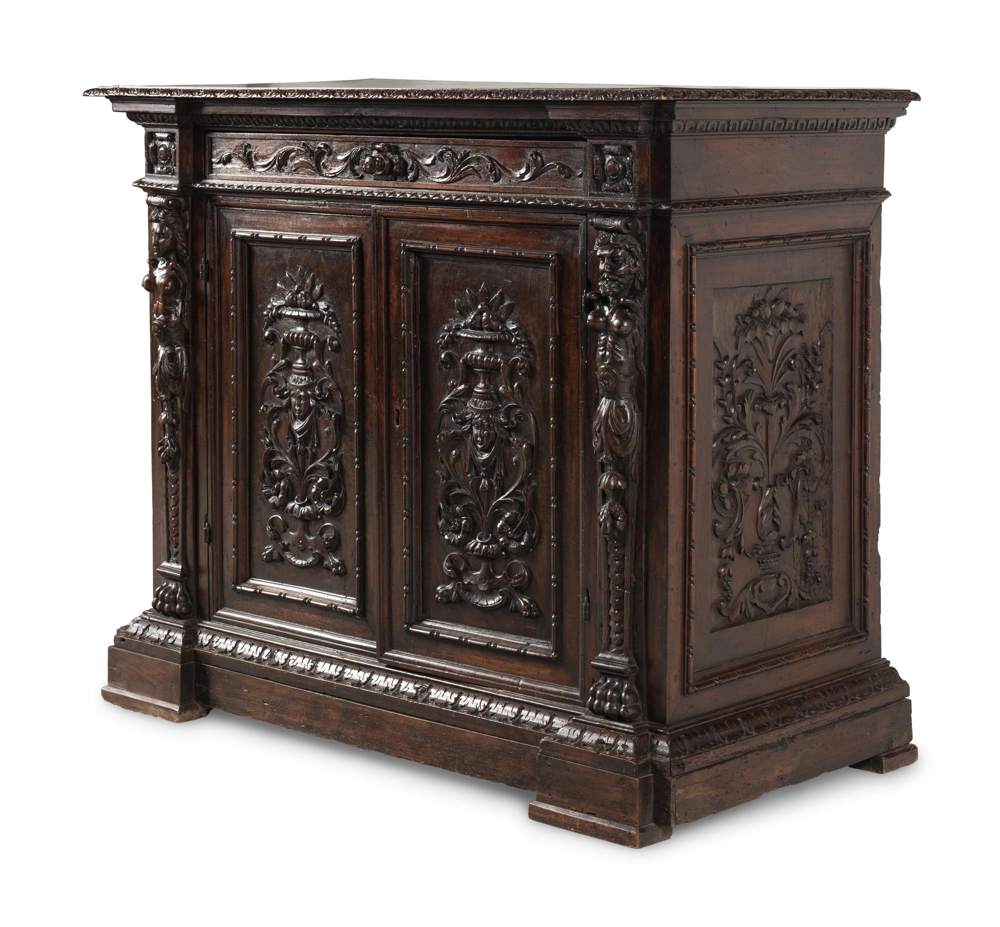 An Italian Baroque Carved Walnut Cabinet