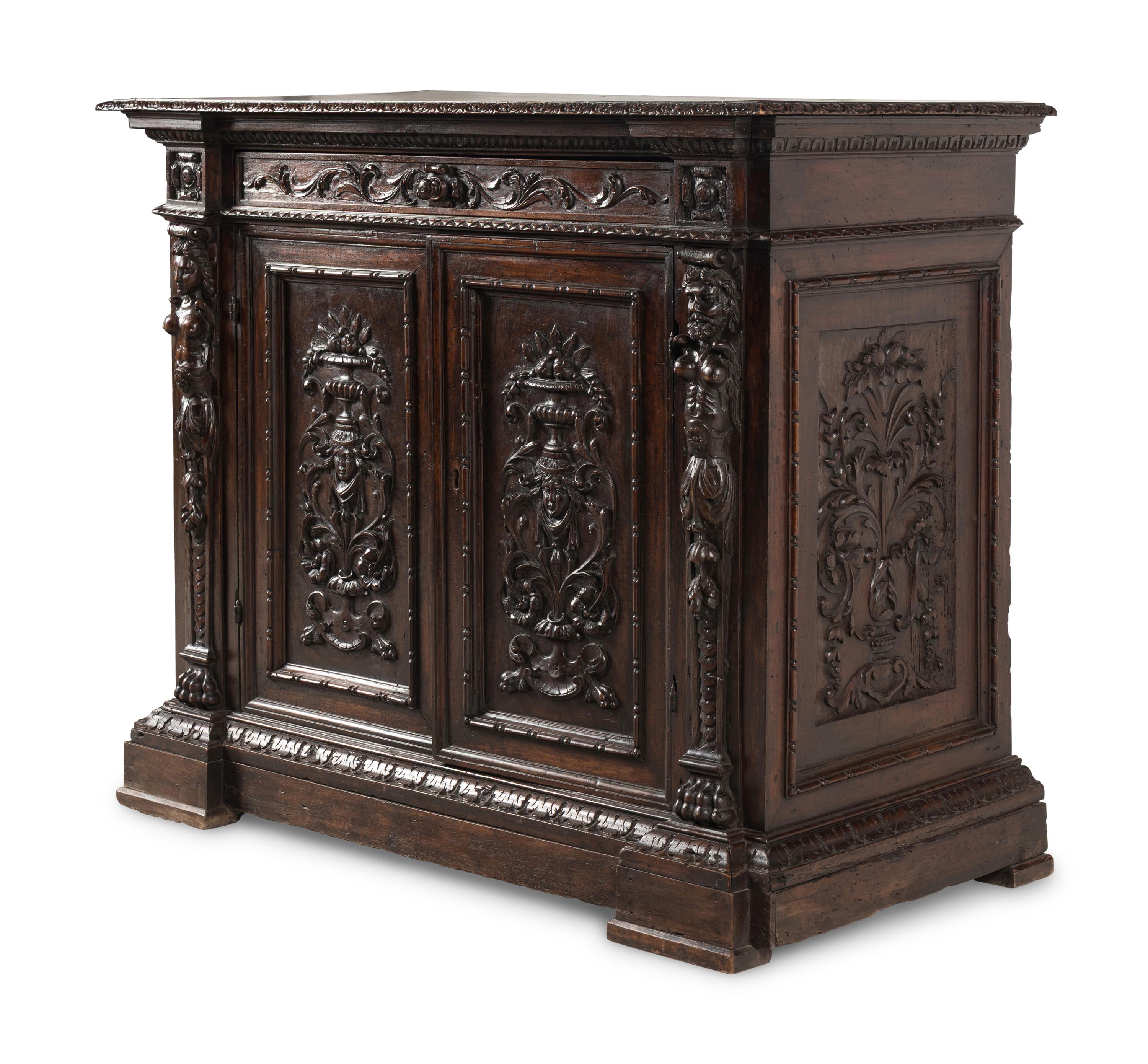 An Italian Baroque Carved Walnut Cabinet