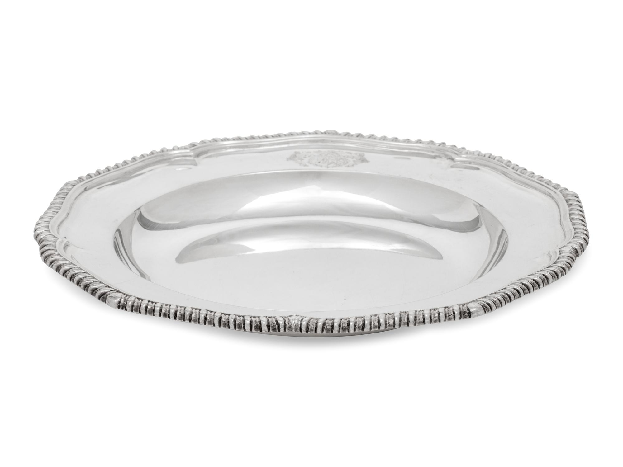 A Set of Twelve Silver Armorial Soup Plates