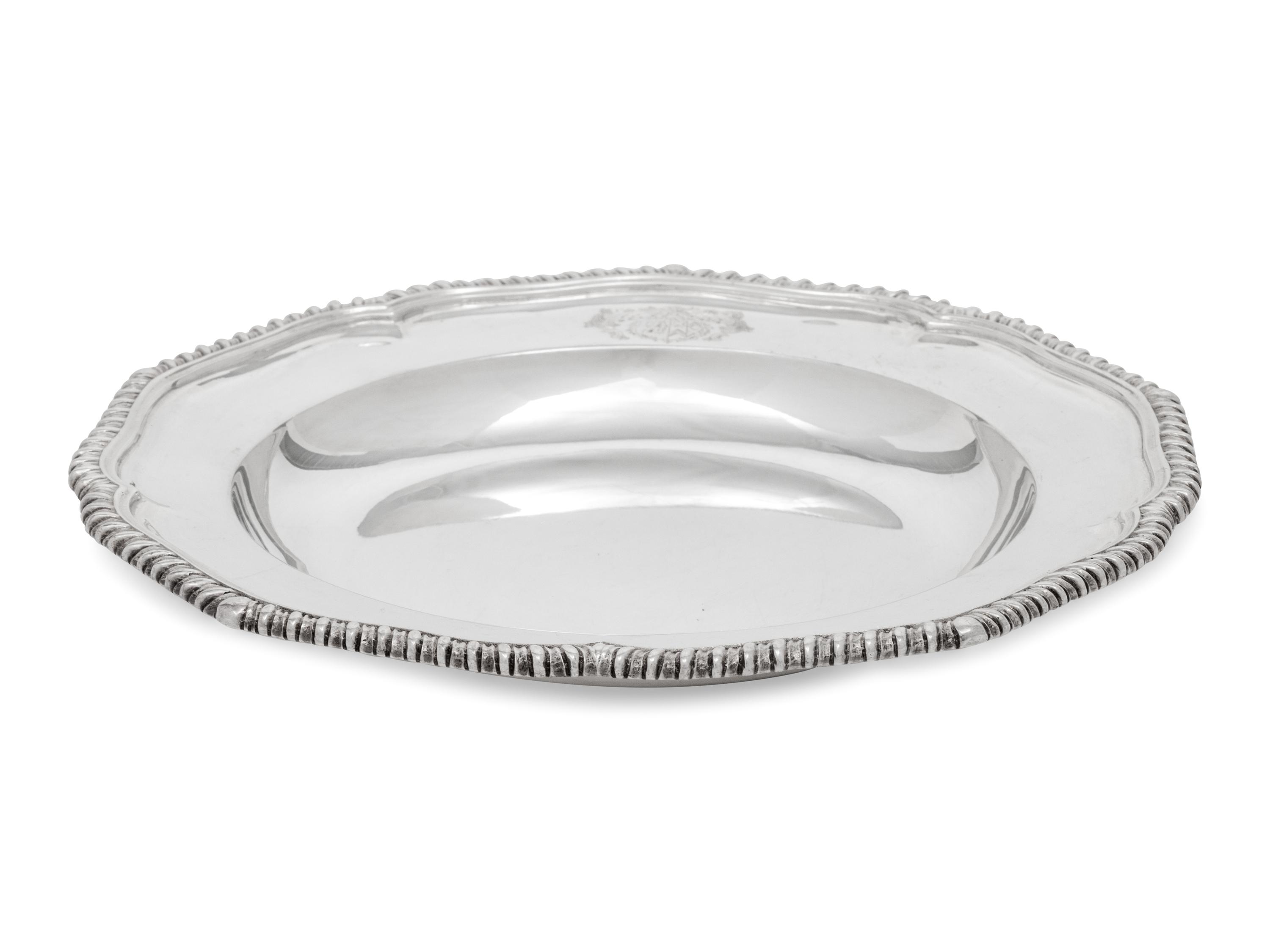A Set of Twelve Silver Armorial Soup Plates