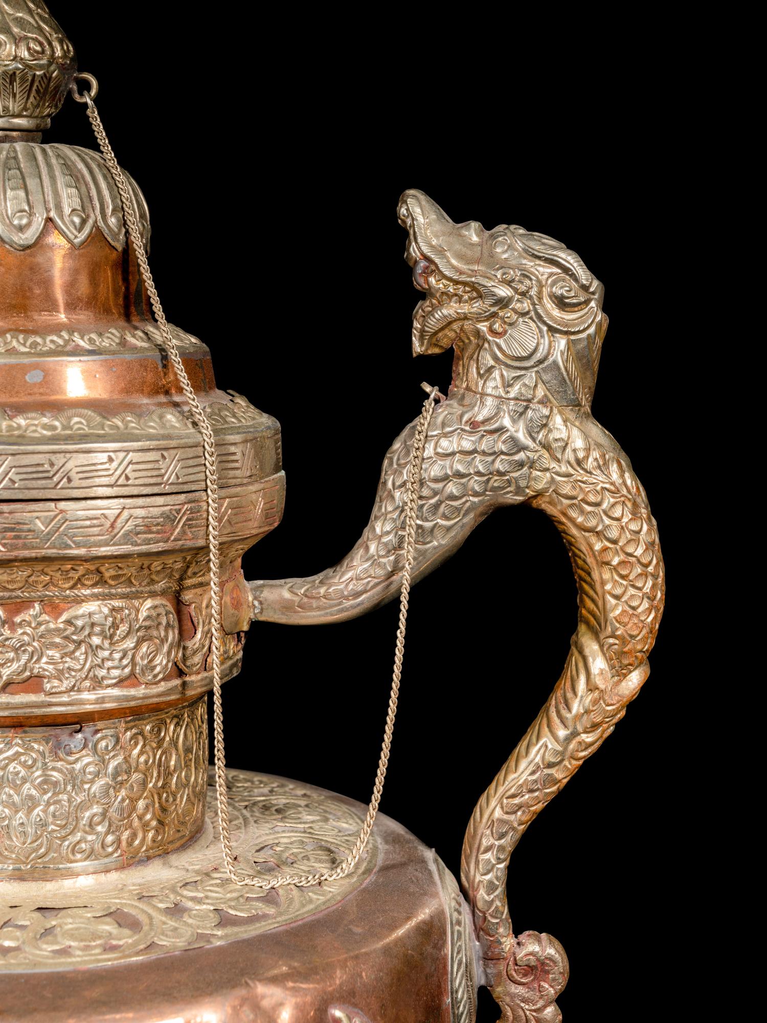 A Tibetan Silver and Copper Covered Ewer and A Chinese Bronze Pitcher