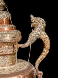 A Tibetan Silver and Copper Covered Ewer and A Chinese Bronze Pitcher