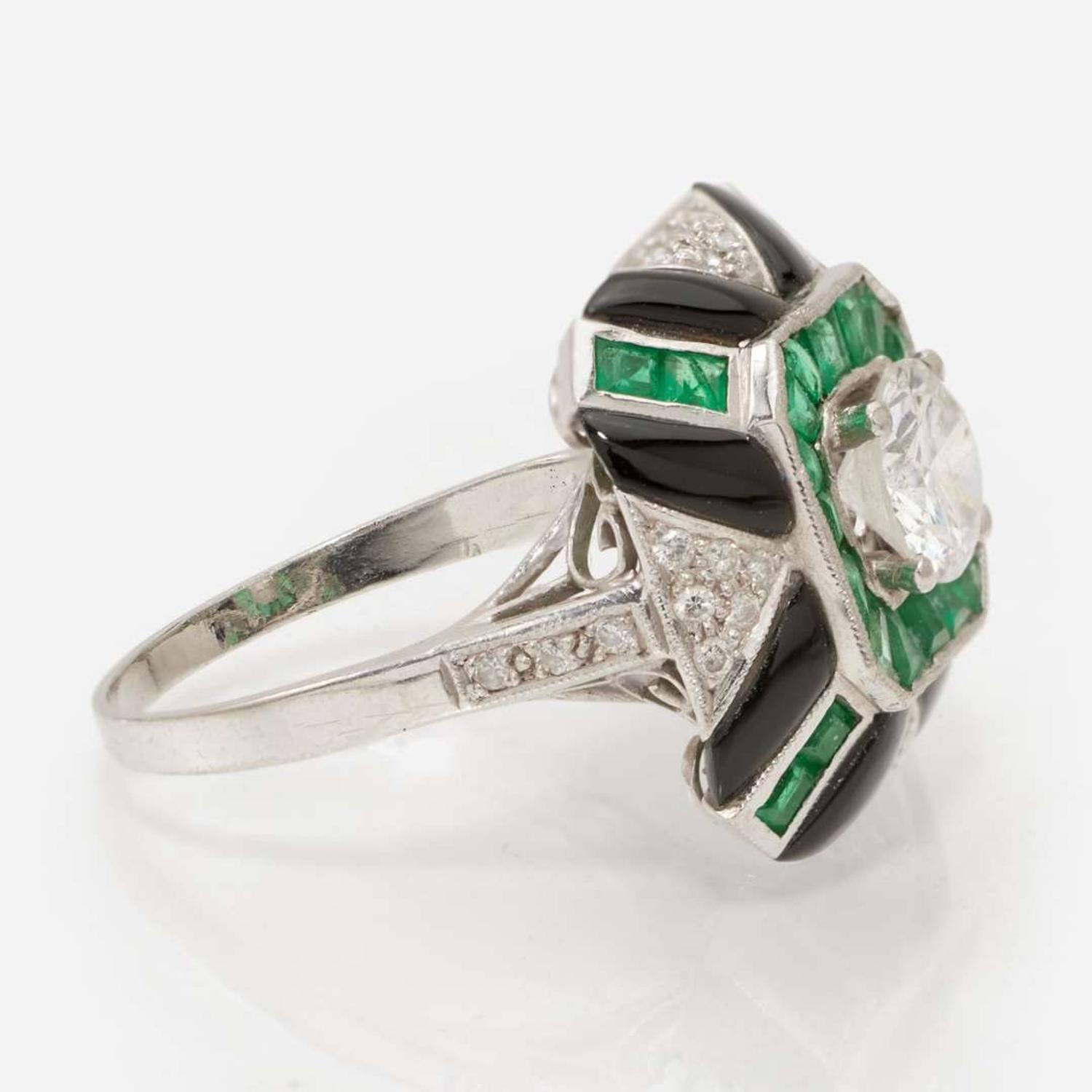 A Platinum, Diamond, and Gemstone Ring