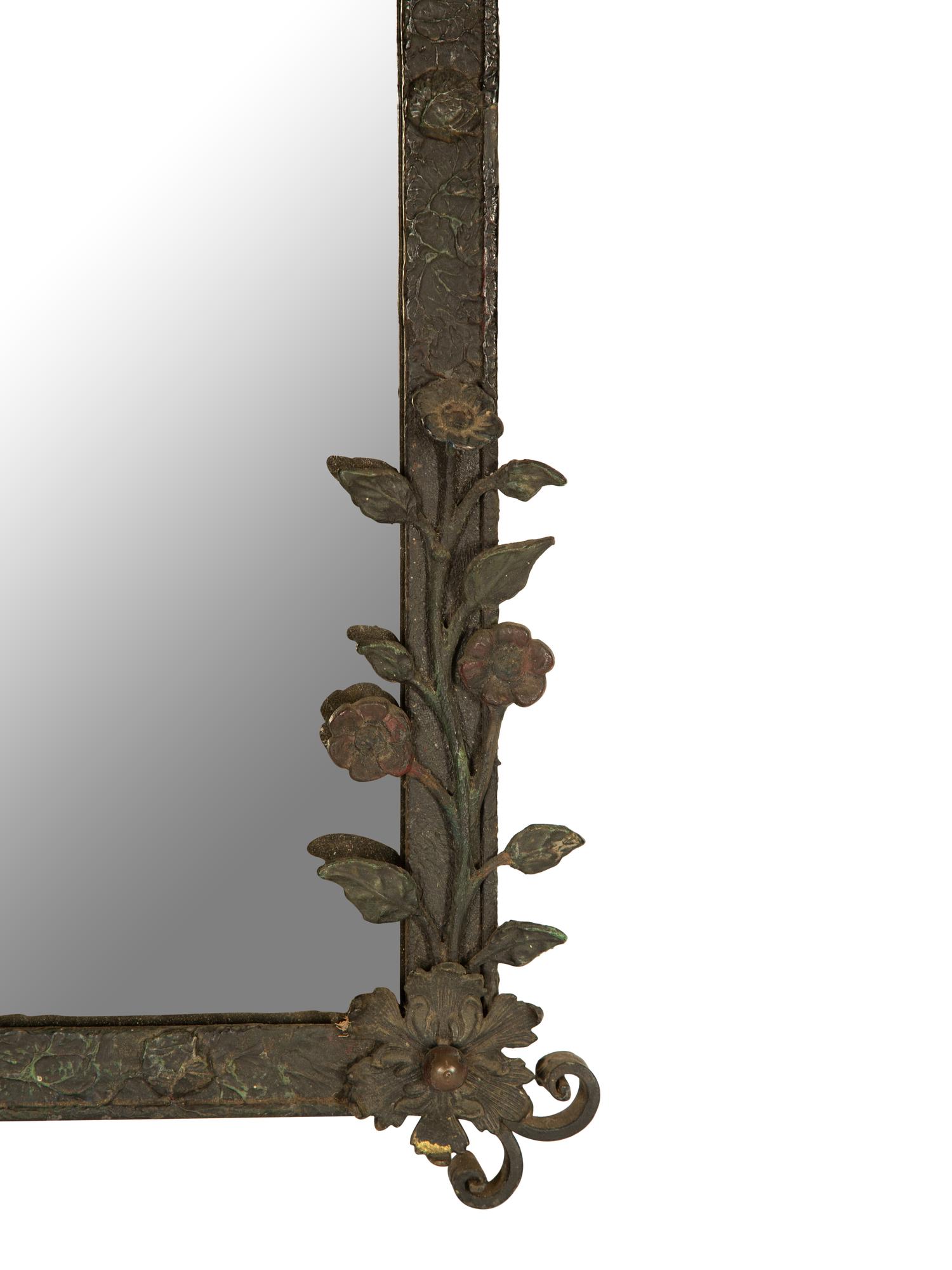 A Wrought Iron Framed Mirror