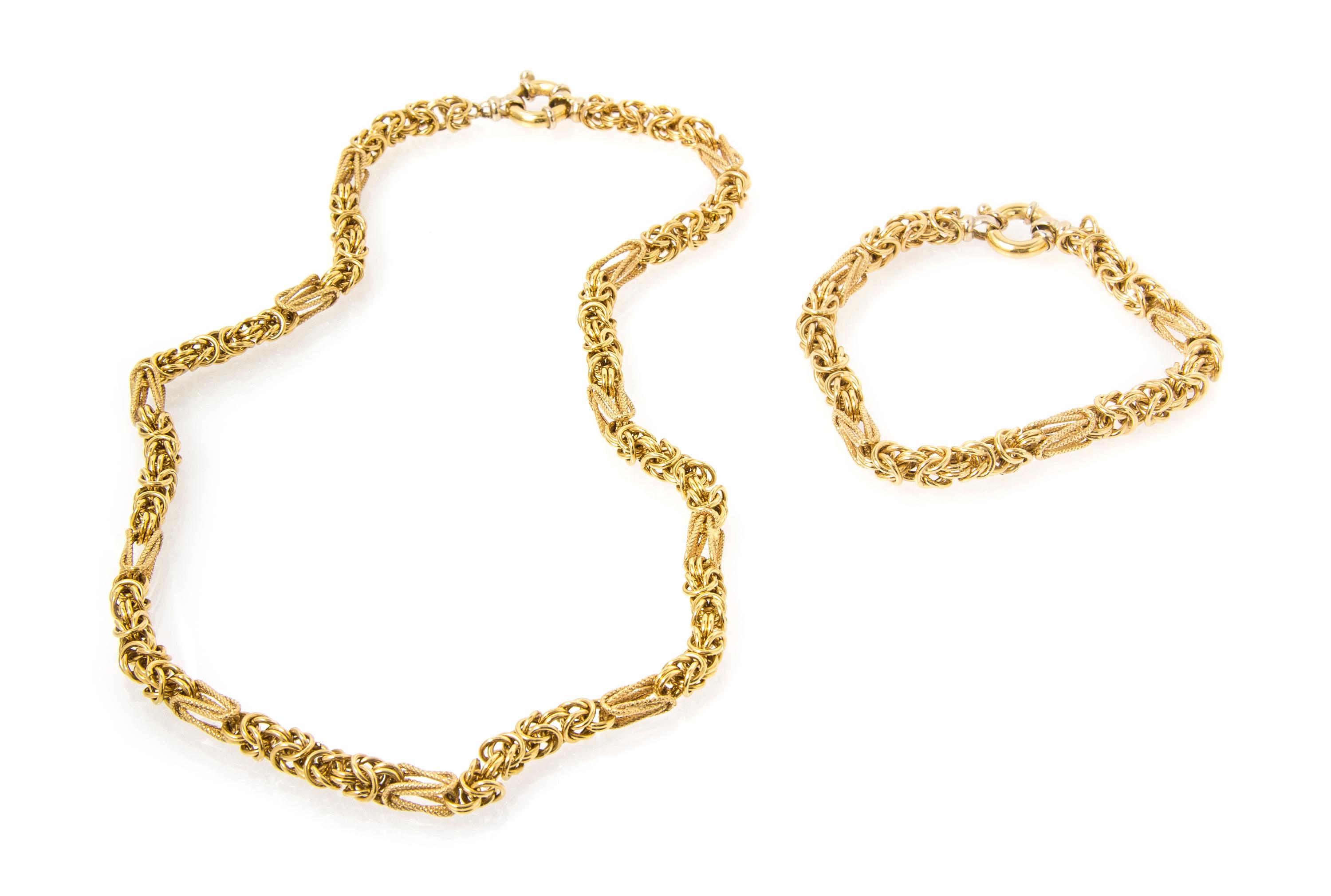 An 18 Karat Yellow Gold Birdcage Link Demi Parure, 22.60 dwts.