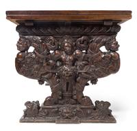 An Italian Baroque Carved Walnut Refectory Table Height 34 1/4 x width 63 3/4 (closed) x depth 36 1/8 inches. — FLORENCE, 16TH CENTURY AND LATER