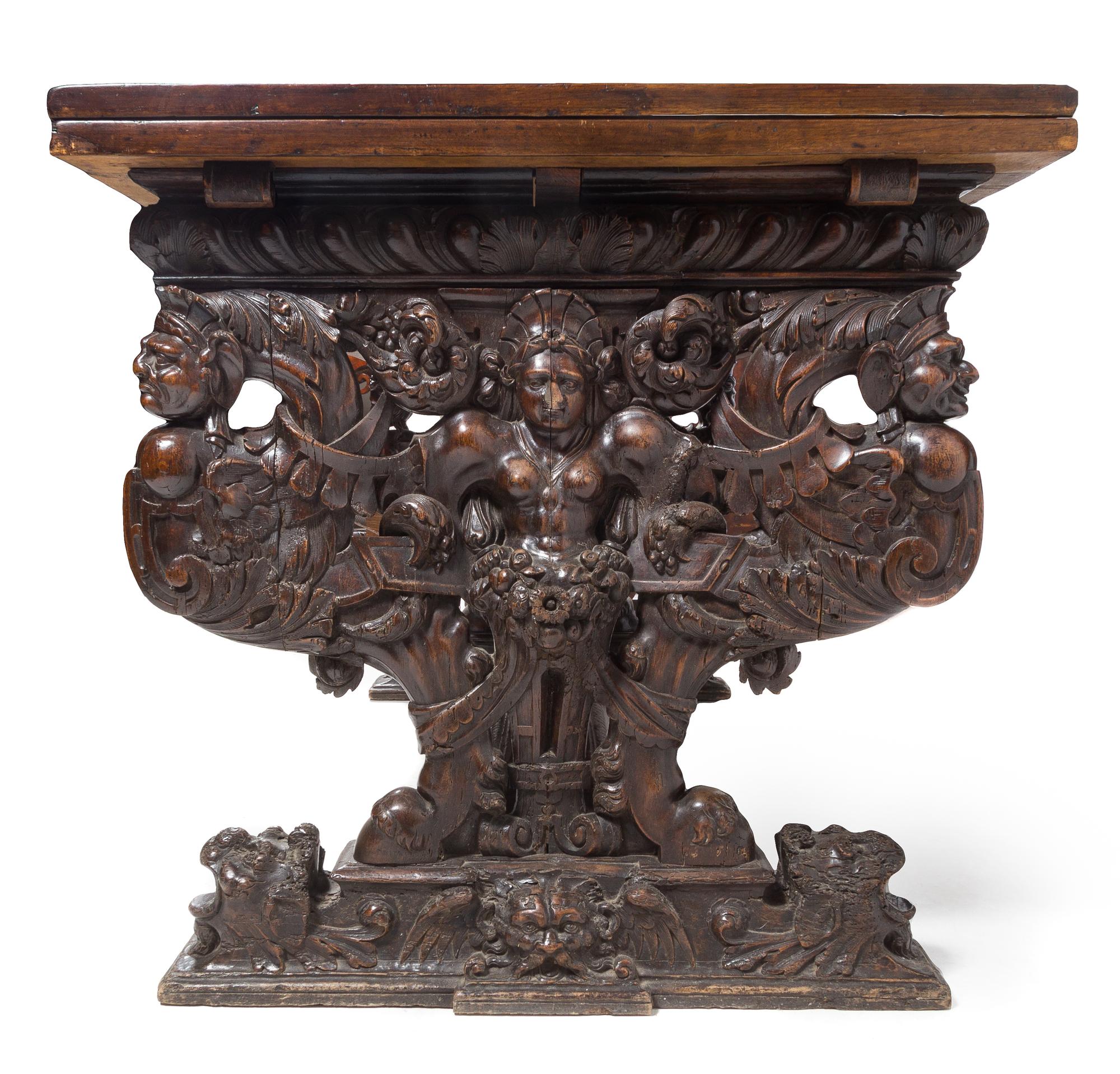 An Italian Baroque Carved Walnut Refectory Table Height 34 1/4 x width 63 3/4 (closed) x depth 36 1/8 inches. — FLORENCE, 16TH CENTURY AND LATER