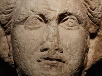 A Cypriot Limestone Head of a Goddess, Perhaps Aphrodite or Demeter