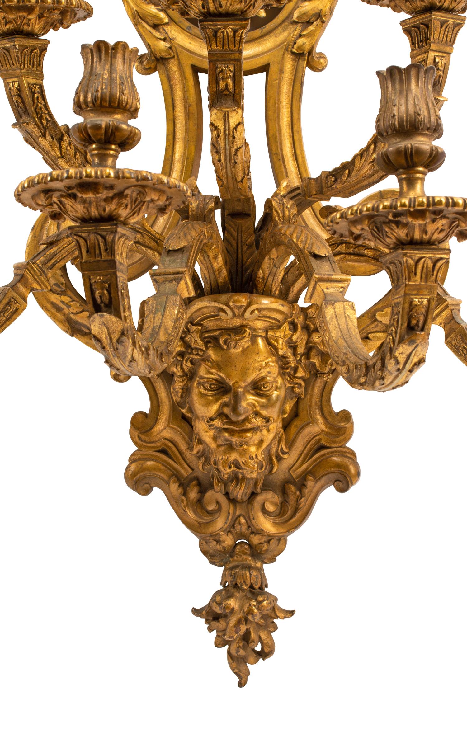 A Pair of Régence Style Gilt Bronze Seven-Light Sconces