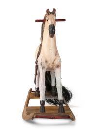 A Carved and Painted Wooden Rocking Horse