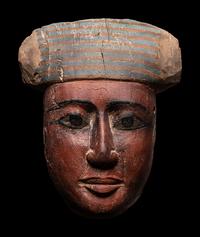 An Egyptian Polychrome Wood Mummy Mask