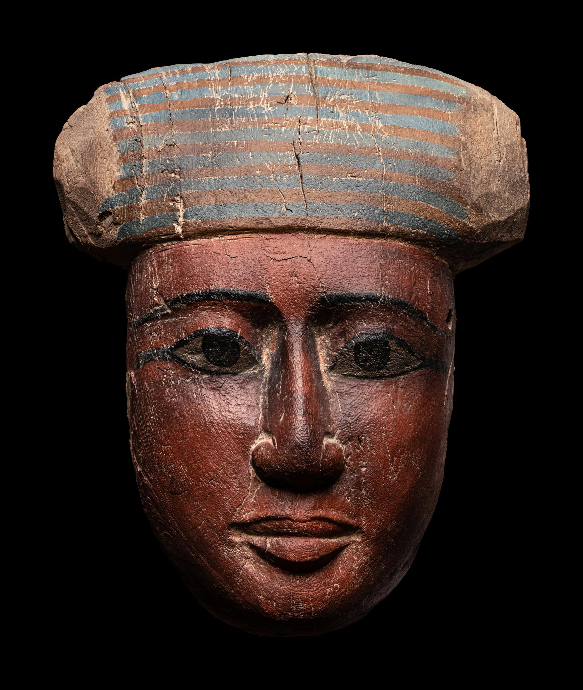 An Egyptian Polychrome Wood Mummy Mask
