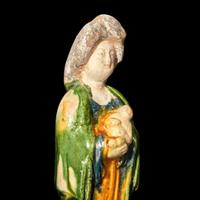 A very rare Chinese small sancai-glazed pottery figure of a woman and baby 珍罕仕女抱婴唐三彩 Tang dynasty ?