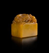 A Carved Yellow Soapstone Seal Height 2 1/2 inches.