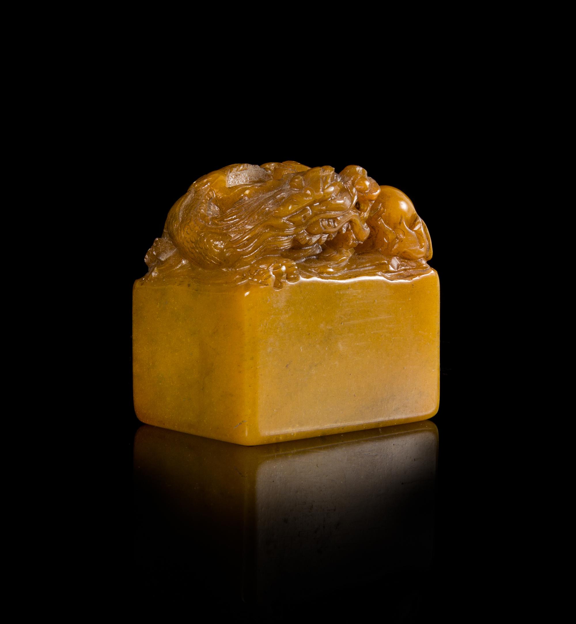 A Carved Yellow Soapstone Seal Height 2 1/2 inches.
