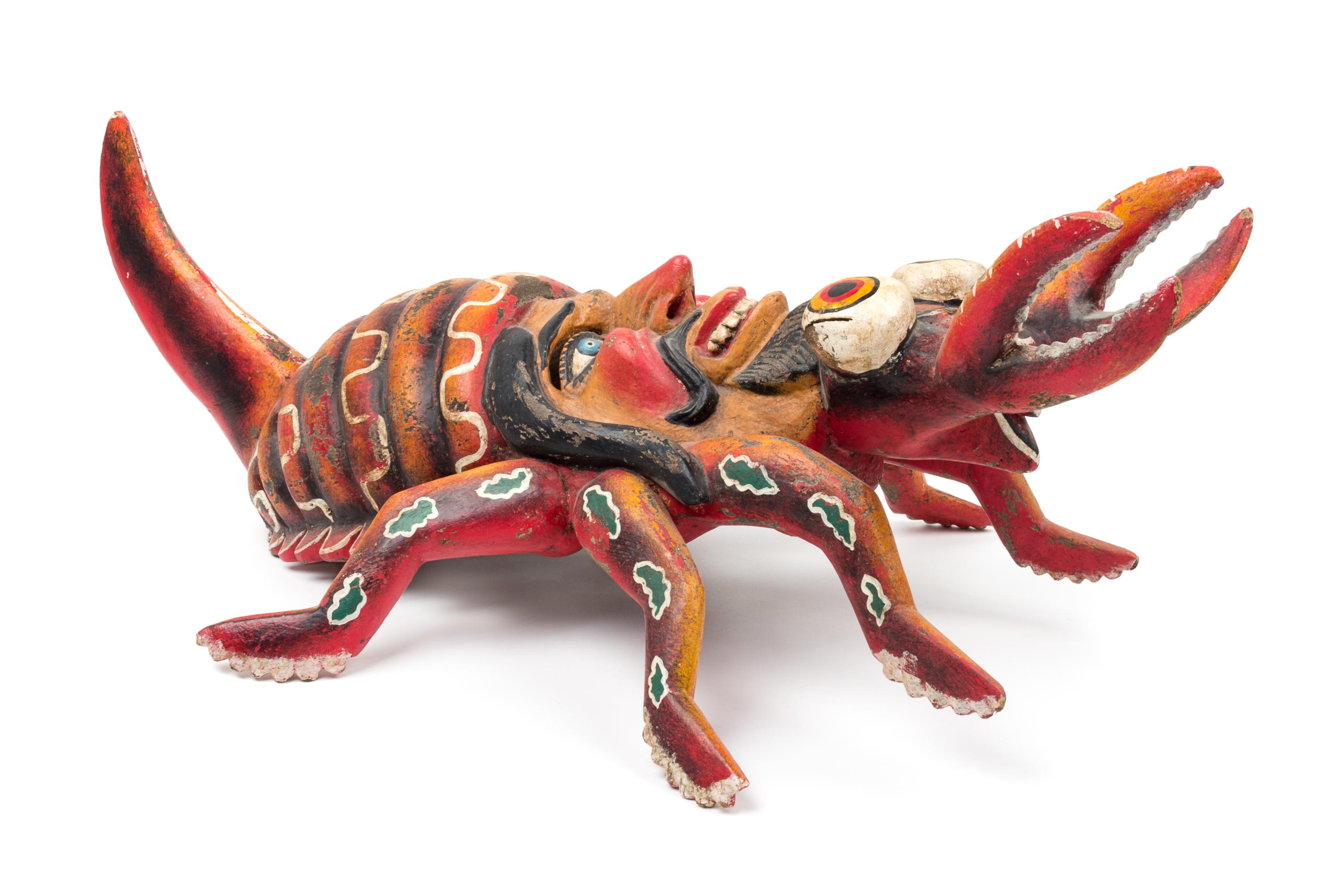 A Mexican Polychromed Wood Mask Height 30 1/2 inches.