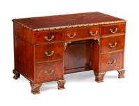 A George III Style Parcel-Gilt Mahogany Kneehole Desk — LATE 19TH/EARLY 20TH CENTURY