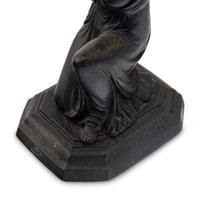 A Pair of Grand Tour Patinated Metal Figural Candlesticks