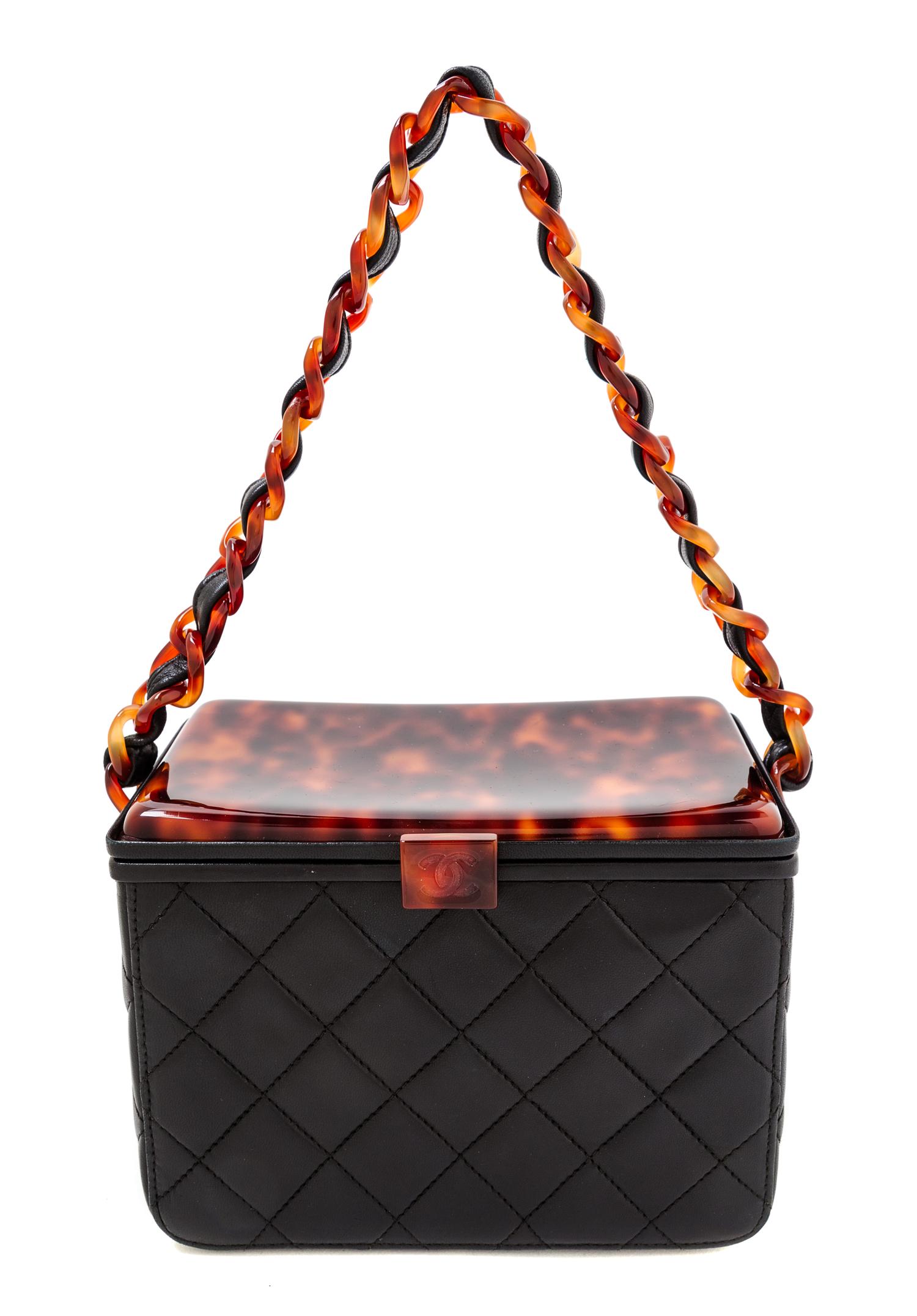 A Chanel Black Leather Quilted Box Bag, 5" x 7" x 4".