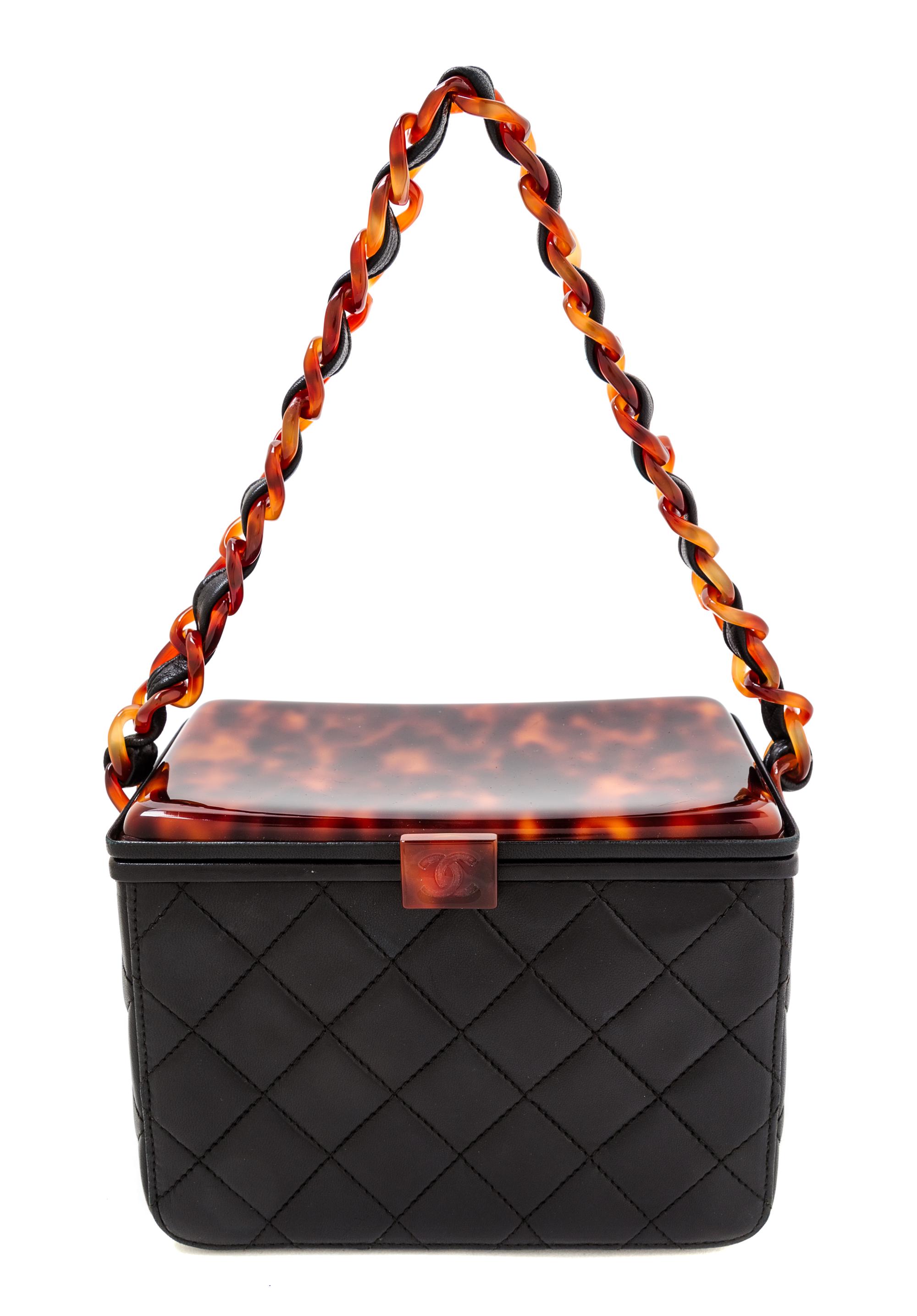A Chanel Black Leather Quilted Box Bag, 5" x 7" x 4".