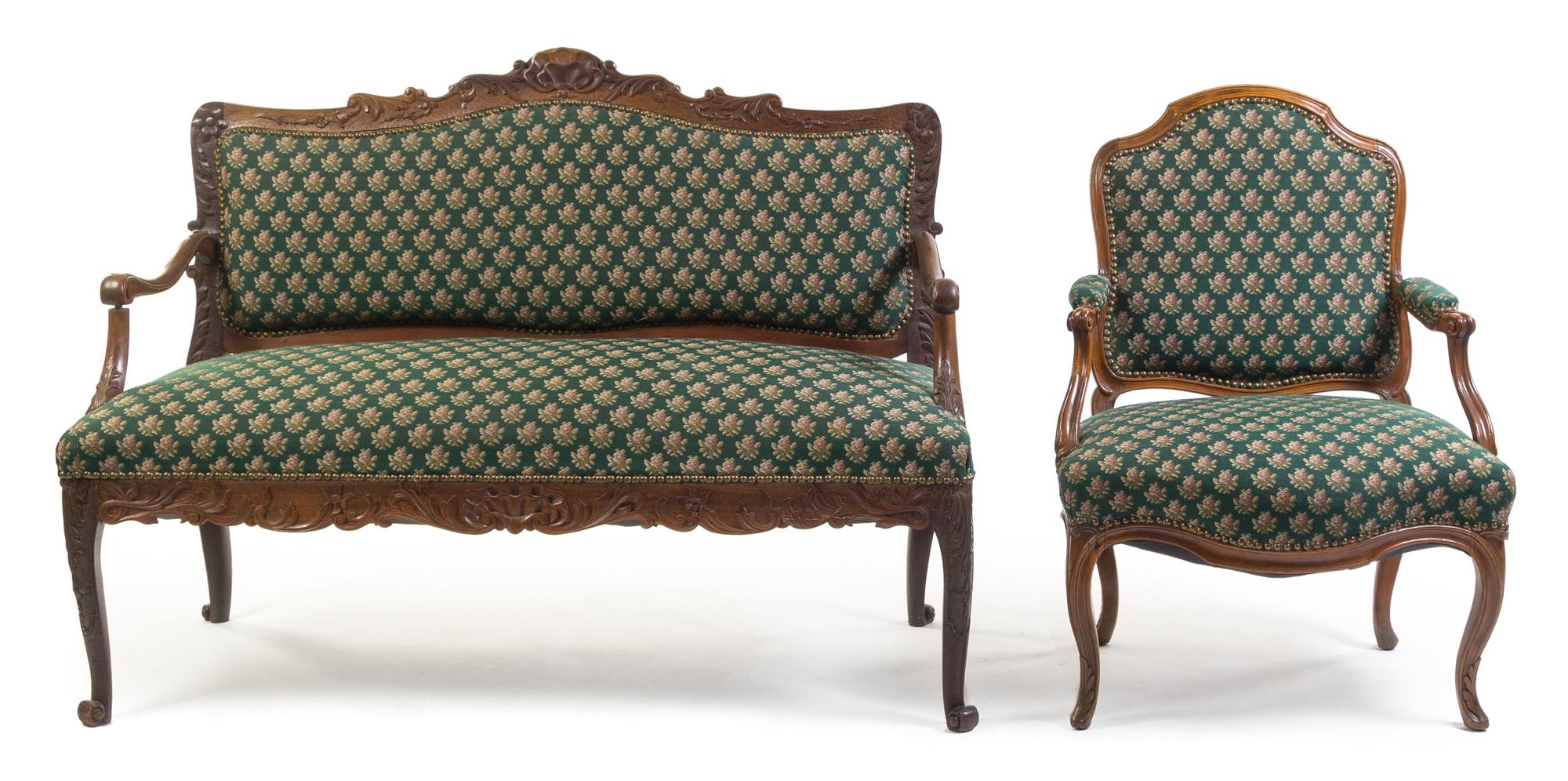 A Louis XV Style Oak Settee and Fauteuil Height 38 1/2 x width 53 x depth 23 inches.