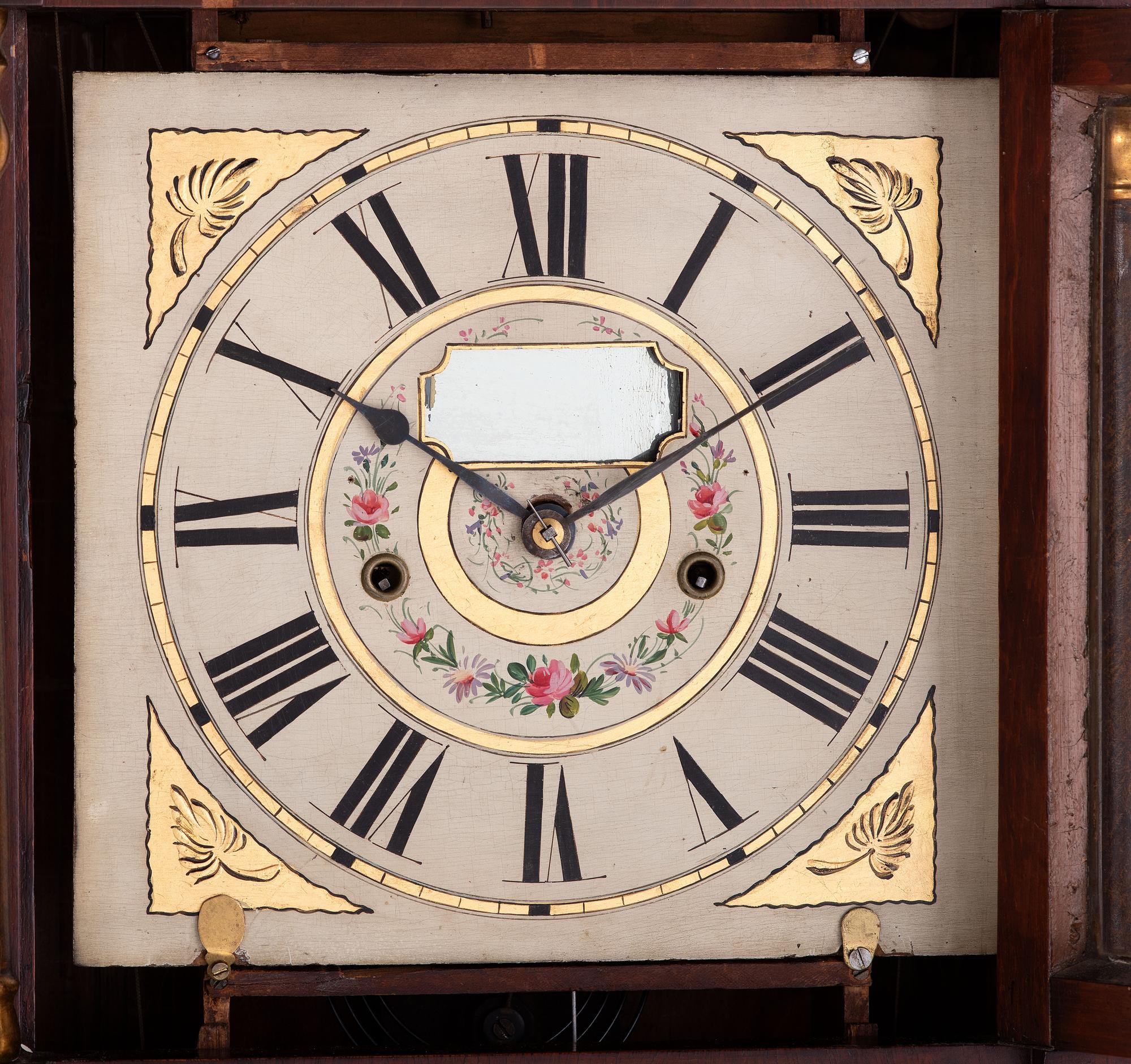 A Mahogany Eglomise and Parcel Gilt Mantel Clock