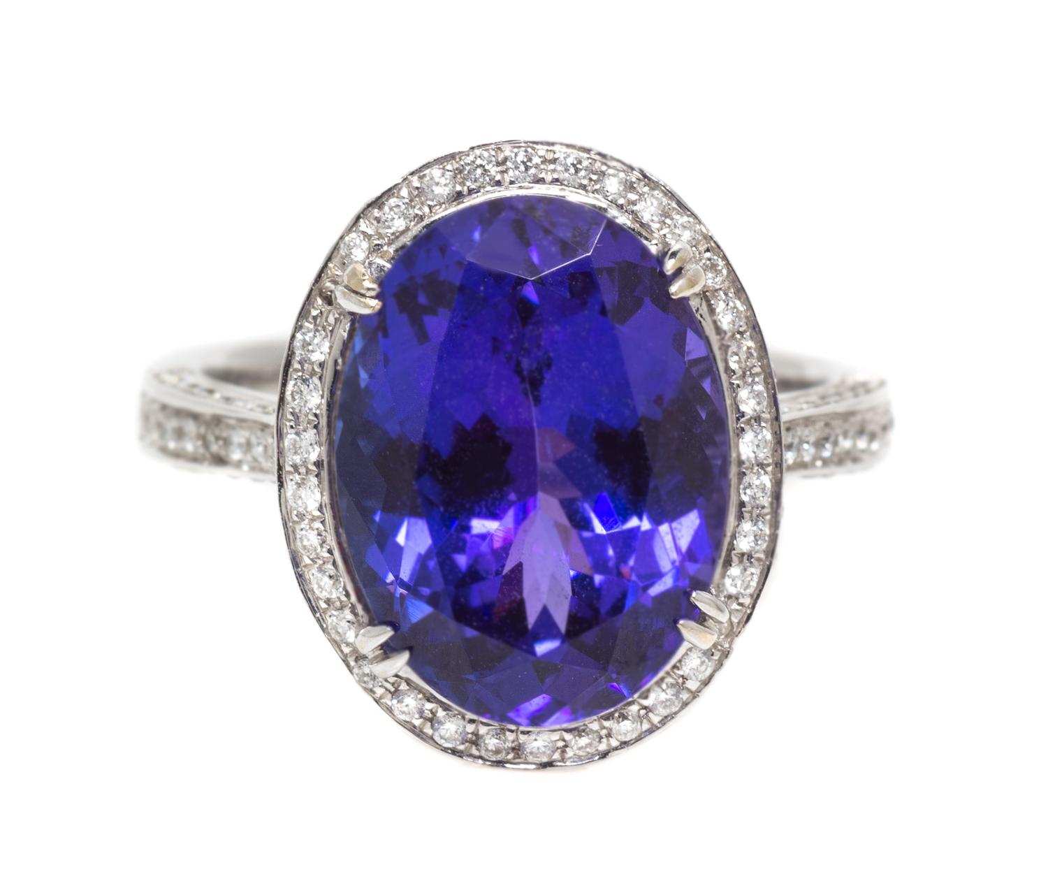 An 18 Karat White Gold Oval Cut Tanzanite and Diamond Ring, 5.10 dwts.