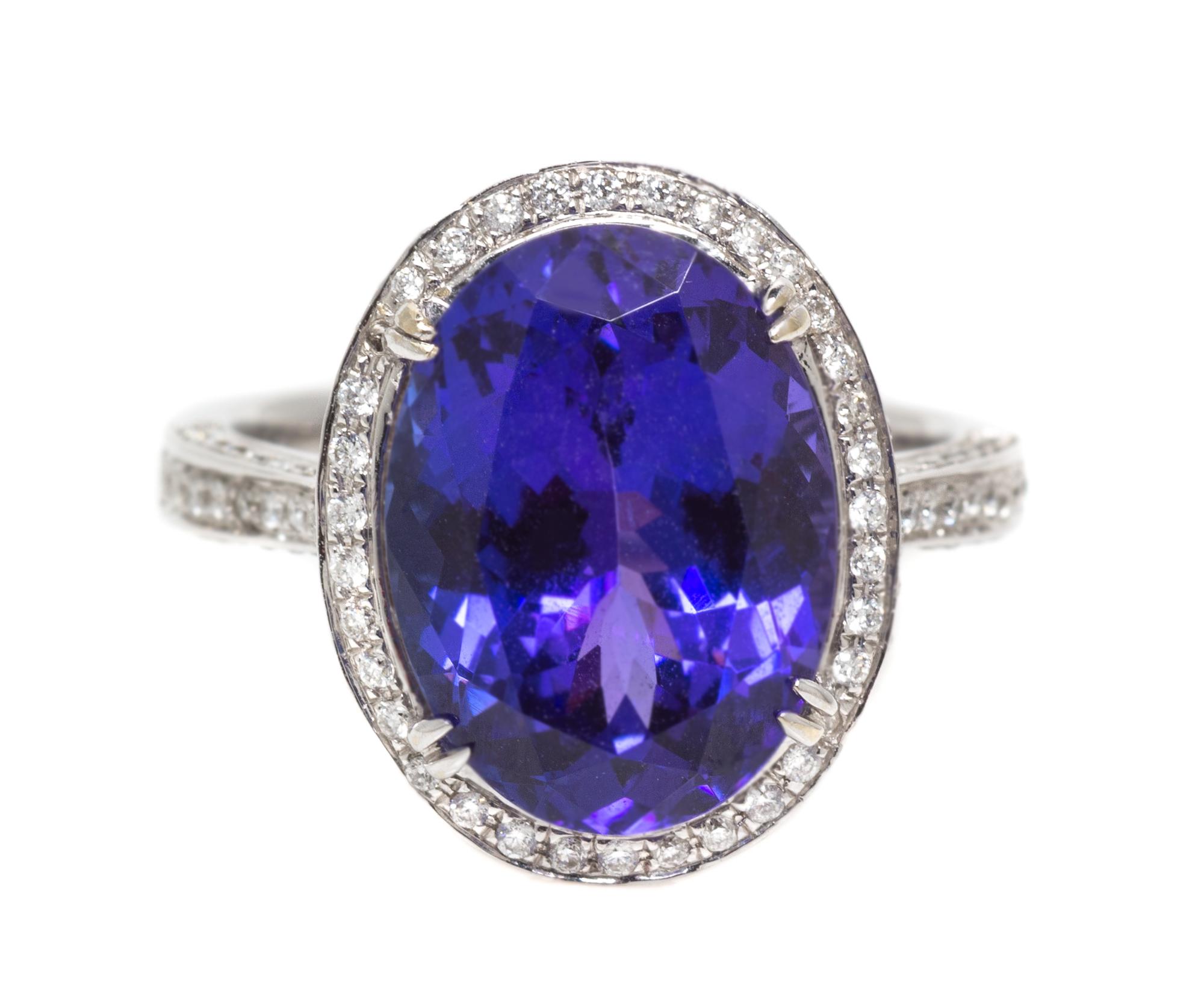 An 18 Karat White Gold Oval Cut Tanzanite and Diamond Ring, 5.10 dwts.