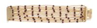 An 18 Karat Yellow Gold and Garnet Multi Strand Bracelet, French, 29.60 dwts.