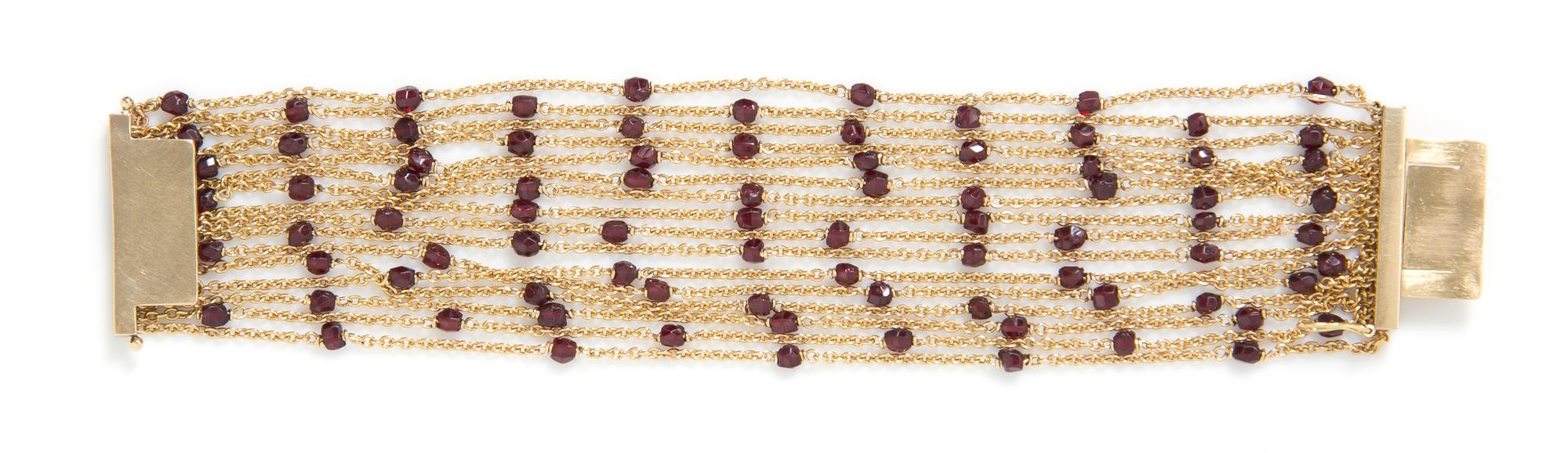 An 18 Karat Yellow Gold and Garnet Multi Strand Bracelet, French, 29.60 dwts.