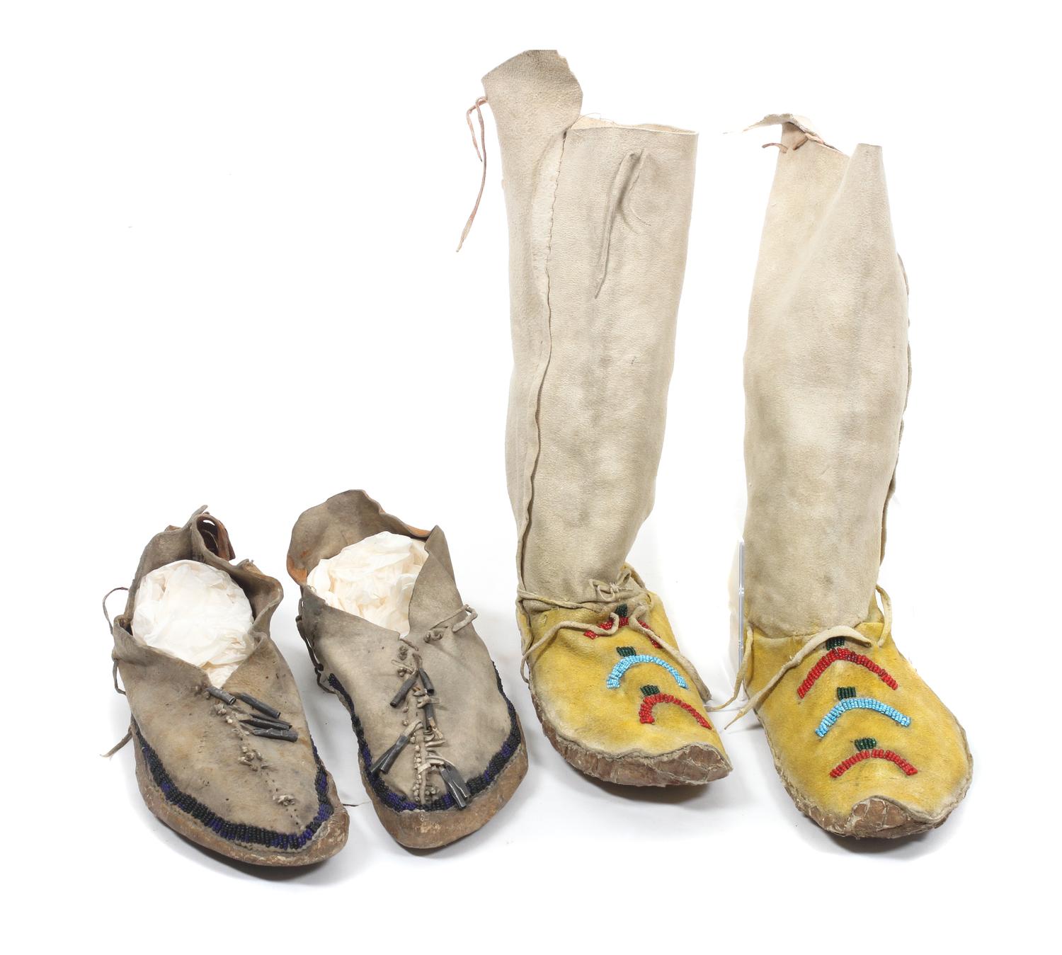 A Pair of Tall Jicarilla Apache Beaded Moccasins Height of first approximately 12 1/2 inches.