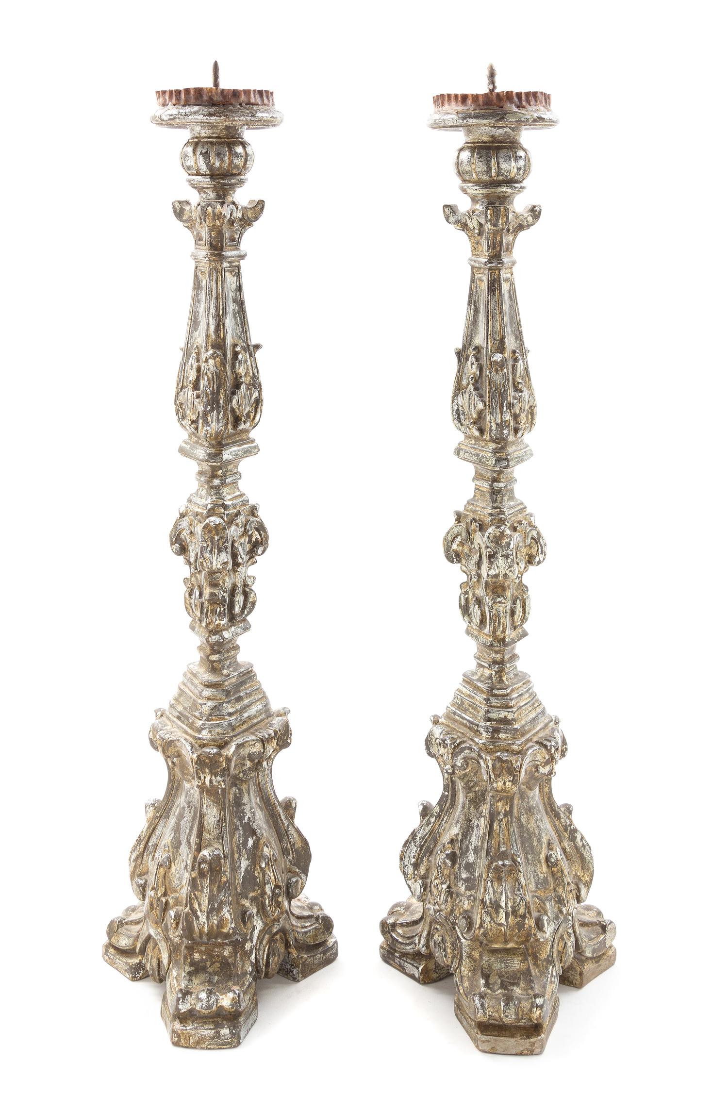 A Pair of Venetian Silvered and Carved Wood Prickets Height 30 3/4 inches. — 20TH CENTURY