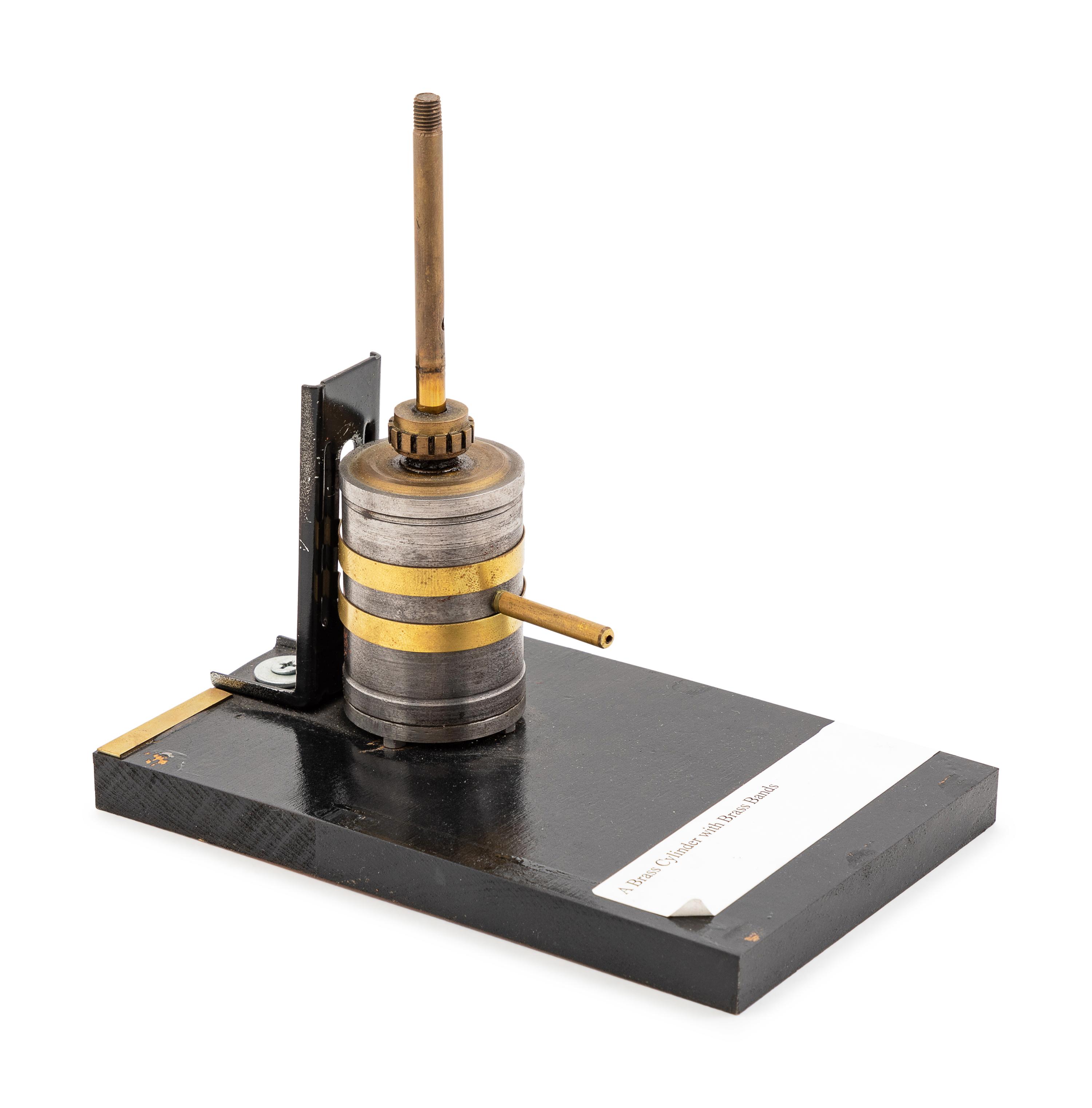 A Brass Banded Metal Engine Cylinder Demonstration Model