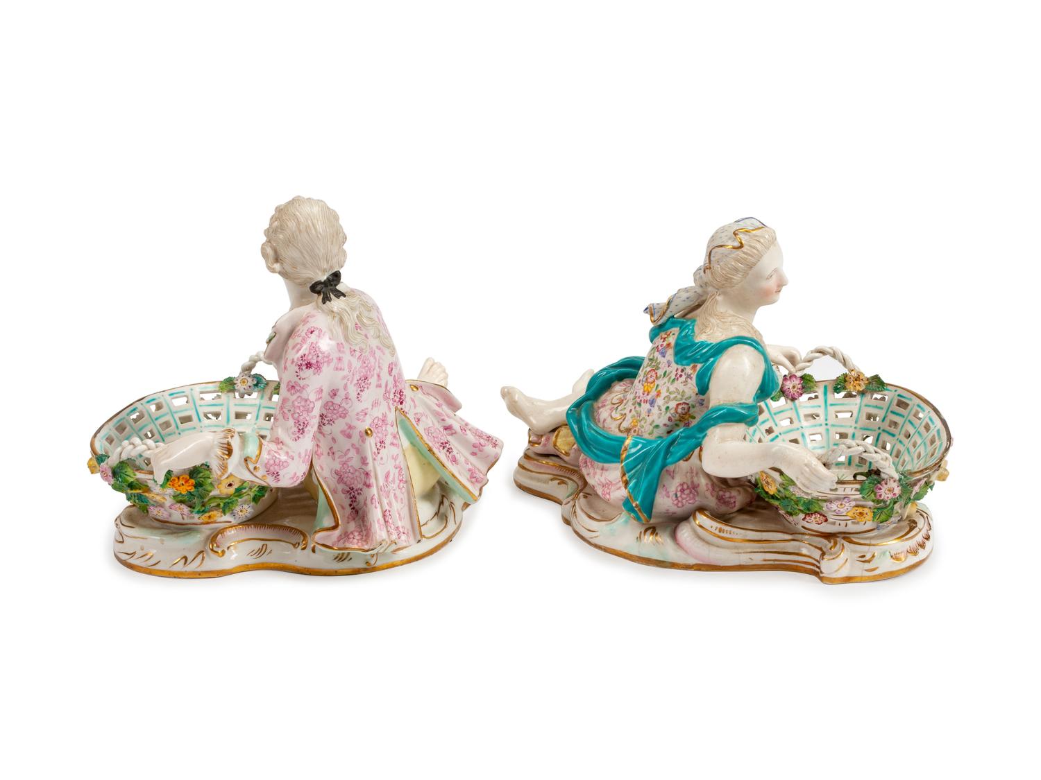 A Pair of German Porcelain Figural Sweetmeat Dishes
