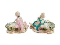 A Pair of German Porcelain Figural Sweetmeat Dishes