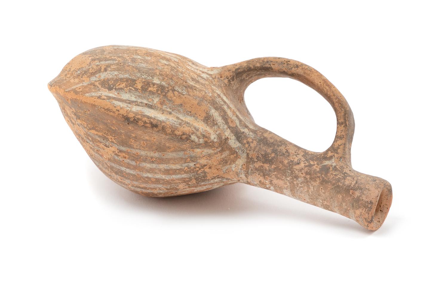 A Mediterranean Terra Cotta Vessel Height 5 1/2 inches.