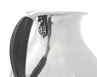 A Group of Four Georg Jensen Silver Pitchers