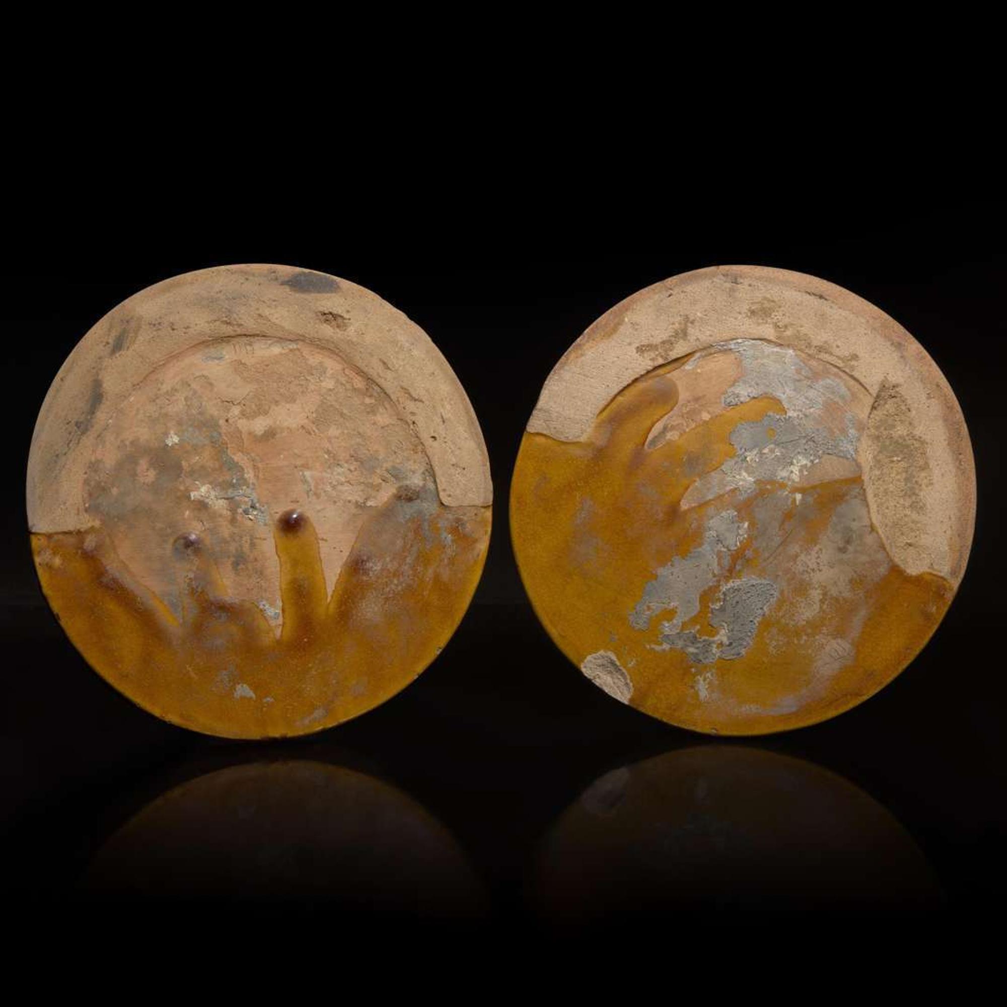 Two Chinese yellow glazed "Dragon" roof tile ends 黃釉龍紋瓦當兩片 Probably Ming dynasty