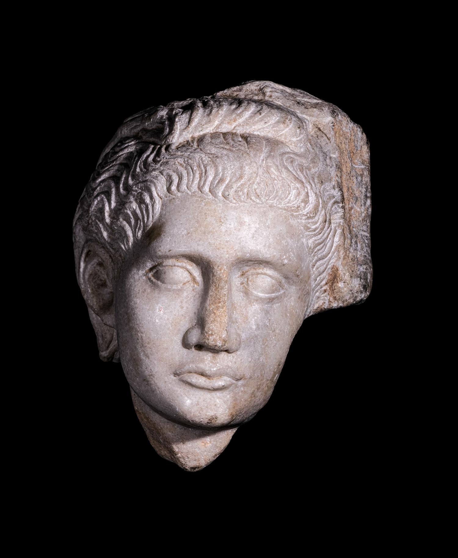 A Roman Marble Relief with a Female Head