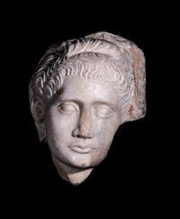 A Roman Marble Relief with a Female Head