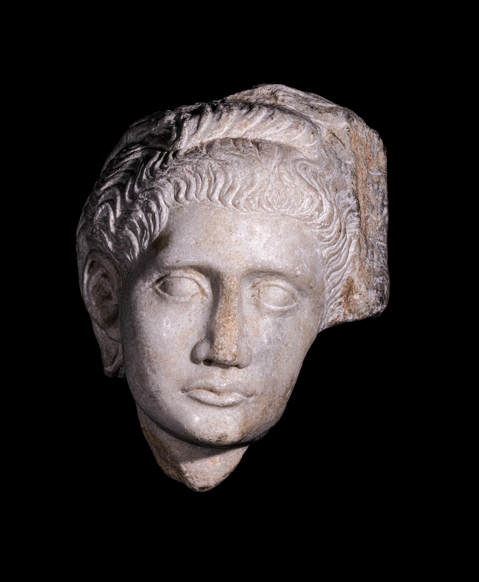 A Roman Marble Relief with a Female Head