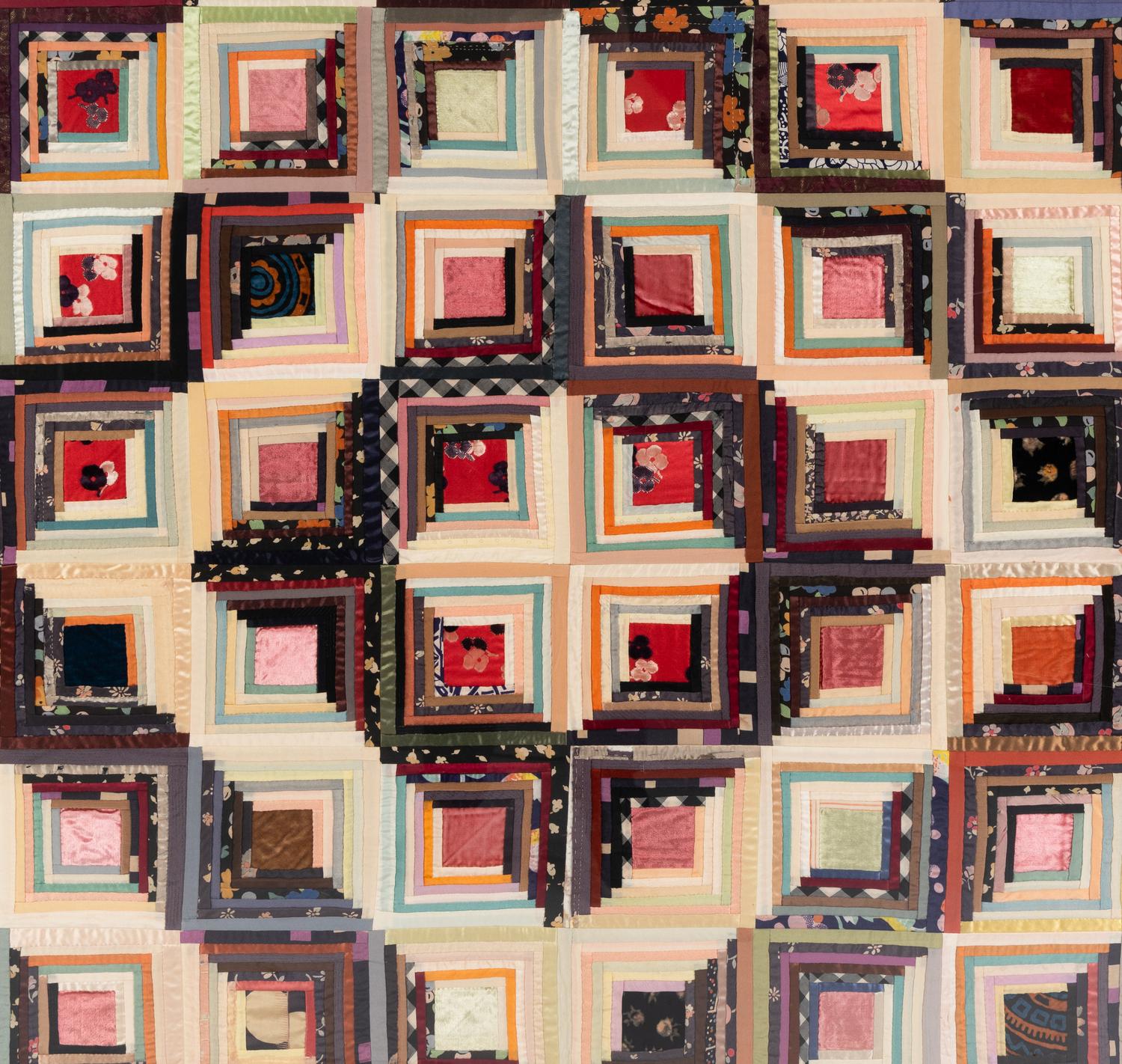 A Log Cabin Pattern Pieced Silk and Satin Quilt